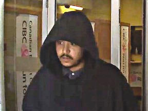 Investigators need help identifying this man, who is suspected of robbing a bank in Etobicoke in August.