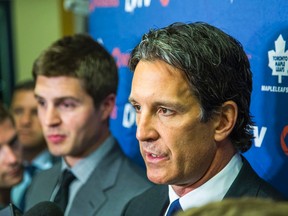 Leafs team president Brendan Shanahan (front) and newly hired Toronto Maple Leafs assistant general manager  Kyle Dubas (left) talk to the media at the Air Canada Centre in Toronto, Ont.  on Tuesday July 22, 2014. (Ernest Doroszuk/Toronto Sun/QMI Agency)