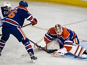 Edmonton Oilers goalie Viktor Fasth stops Winnipeg Jets Eric Tangradi from scoring during a pre-season game at Rexall Place on September 29, 2014. (Codie McLachlan/Edmonton Sun/QMI Agency)