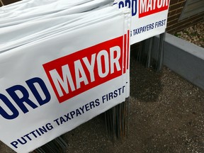 Hundreds of Ford for Mayor lawn signs ready to go at Doug Ford's campaign office in Toronto on Thursday, October 2, 2014. (Dave Abel/Toronto Sun)