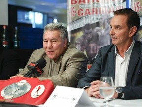 Canadian boxing legend George Chuvalo (left) and businessman Les Woods chat to reporters at a press conference on Wednesday promoting an Oct. 25 Canadian heavyweight title bout between Dillion Carman and Eric Martel Bahoeli in Toronto. (VERONICA HENRI/TORONTO SUN)