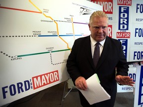Mayoral candidate Doug Ford unveils his updated subway plan at his campaign office in Toronto, Ont. on Thursday, October 2, 2014. (Dave Abel/Toronto Sun)