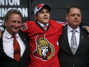Senators first-rounder pick Erik Karlsson, flanking owner Eugene Melnyk and assistant GM Tim Murray at the 2008 draft, anchors the Swedish defence. OTTAWA SUN FILES
