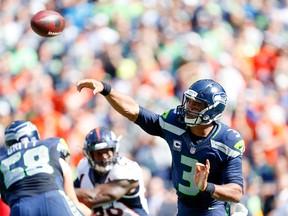 Seahawks quarterback Russell Wilson wrote that he used to be a bully in school before finding faith. (USA TODAY SPORTS)