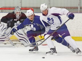 Josh Leivo (right), using his body to protect the puck against William Nylander during Thursday’s practice in Collingwood, was skating on the Maple Leafs’ second line. (MORGAN IAN ADAMS/PHOTO)