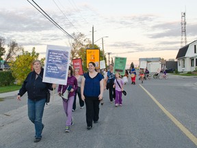 Protestors walk through-out Cochrane, to raise awareness of issues women face with sexual assault and street violence, during the Thursday Sept 25. Take Back The Night walk