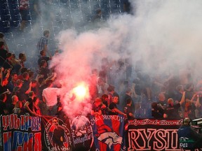 CSKA Moscow's supporters clash with stewards and policemen during their Champions League Group E match against AS Roma at the Olympic Stadium in Rome on Sept. 17, 2014. (Alessandro Bianchi/Reuters)