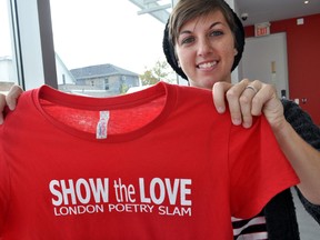 London poet Holly Painter holds a London Poetry Slam t-shirt at Edgar and Joe’s Café in London, Ont. October 2, 2014. Painter and four others from London will be performing at the Canadian Festival of Spoken Word in Victoria BC October 13-18. CHRIS MONTANINI\LONDONER\QMI AGENCY