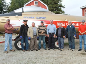 Members of the COPA Flight 7 group, who volunteered time to restore the Golden Hawk Sabre jet. From left to right: Ed Butler, David Cooke, Dennis Smith, Joe Sauve, Rick West, Tom Dunn, Robert Burns and Darren McKeegan.