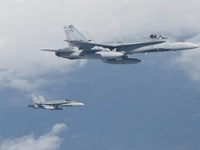 Two CF-18s from 4 Wing Cold Lake are seen in this file photo taken in Cold Lake, Alta., in May 2009. (Corporal Patrick Drouin/QMI Agency file photo)