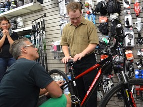 Chad Schimmel checks out his new bike on Sept. 30 at Mud, Sweat and Gears in Spruce Grove. - Thomas Miller, Reporter/Examiner