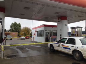 An RCMP vehicle sits outside Petro-Canada on McLeod Avenue in Spruce Grove after a man robbed the attendant at knifepoint on Sept. 26. Police tape cordons off the scene of the crime. - Thomas Miller, Reporter/Examiner
