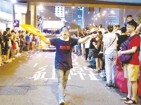 Pro-democracy protesters gather in the Admiralty district of Hong Kong this week. Hong Kong has been plunged into the worst political crisis since its 1997 handover as pro-democracy activists take over the streets following China?s refusal to grant citizens full universal suffrage. (XAUME OLLEROS/AFP Photo)