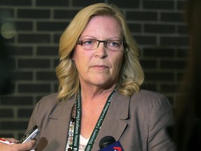 Helen Clark, chief operating officer for emergency response with the Winnipeg Regional Health Authority, speaks to media about ebola procedures during a scrum at the WRHA's offices on Main Street in Winnipeg, Man., on Fri., Oct. 3, 2014.