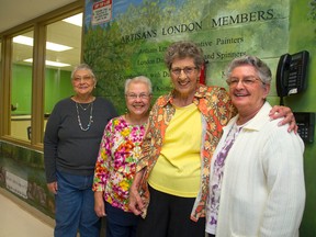 Artists Fran Turner, left, Barb Allen, Marie Dignan and Shirley Prose of the Artisans London Decorative Painters show off the mural to which they contributed at East Lions Artisans Centre in London Friday. (Mike Hensen / The London Free Press)