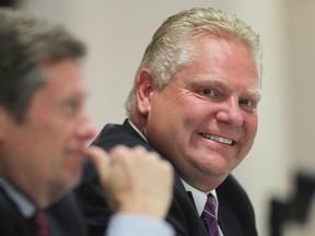 John Tory, left, and Doug Ford at the mayoral debate in Runnymede United Church on Oct. 3, 2014. (Stan Behal/Toronto Sun)