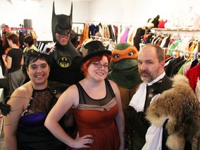 TPC Studios and Canada Costumes owners Nicole Brown, left, Cat Cabajar, and Steve Brown, officially opened their new store space Friday. Joining them to celebrate the occasion were Robert Lawson, dressed as Batman, and Rhonda Pane, as Teenage Mutant Ninja Turtle Michelangelo. TYLER KULA/ THE OBSERVER/ QMI AGENCY