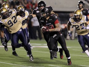 Jonathan Williams of the RedBlacks rushes for a TD against the Blue on Friday. (JANA CHYTILOVA/AFP)