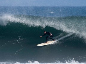 A surfer rides a wave at Malibu Lagoon State Beach in Malibu.

REUTERS/Mario Anzuoni
