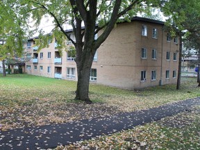 The scene of the city's 32nd shooting, which occurred around 4 p.m. on Friday, Oct.3 near these Ottawa Community Housing rowhouses in the city's west end, near the corner of Iris St. and Cobden Rd.
AEDAN HELMER / OTTAWA SUN/QMI AGENCY