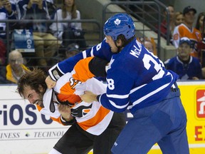 Maple Leafs bruiser Frazer McLaren tangles with Philadelphia Flyers tough guy Zack Stortini during a pre-season game last month. (Craig Glover/QMI Agency)