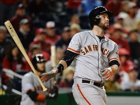 San Francisco Giants first baseman Brandon Belt (9) hits a solo home run in the eighteenth inning against the Washington Nationals in game two of the 2014 NLDS playoff baseball game at Nationals Park on Oct 4, 2014 in Washington, DC, USA. (H. Darr Beiser/USA TODAY Sports)