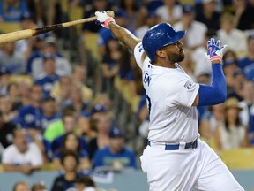 Los Angeles Dodgers left fielder Matt Kemp (27) hits a solo home run in the eighth inning against the St. Louis Cardinals in game two of the 2014 NLDS playoff baseball game at Dodger Stadium on October 4, 2014 in Los Angeles, CA, USA. (Jayne Kamin-Oncea/USA TODAY Sports)