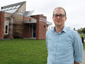 Cole Nadalin stands outside the Lambton College Sustainable Smart House where he's heading the Renewable Energy Conversion and Storage Research (RECSR) project. It was one of two Lambton College projects highlighted during the province-wide Green Energy Doors Open event Saturday. TYLER KULA/ THE OBSERVER/ QMI AGENCY