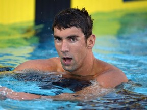 Michael Phelps reacts after placing seventh in the 100m freestyle in the 2014 USA National Championships in Irvine, California, in this file photo taken August 6, 2014.    REUTERS/Kirby Lee-USA TODAY Sports/Files