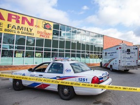 Police at the scene of a shooting on Weston Rd., south of Rogers Rd., in Toronto, Ont. on Sunday October 5, 2014. (Ernest Doroszuk/Toronto Sun)