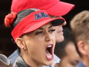 Katy Perry watches the action between the Ole Miss Rebels and the Alabama Crimson Tide on Oct. 4, 2014 at Vaught-Hemingway Stadium in Oxford, Miss.   (Joe Murphy/Getty Images/AFP)