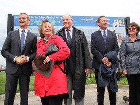 Chris Hadfield, left, and members of his family were honoured with a pair of interpretive signs unveiled at Sarnia Chris Hadfield Airport Sunday. The signs provide information about the link between the airport, the astronaut and his family. TYLER KULA/ THE OBSERVER/ QMI AGENCY