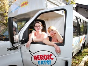 L-R, Margie Hope and Jody Barned owners of The Farmers House in Marda Loop with their old food truck parked in the back as they got out of the food truck business in Calgary, Alta. on Sunday October5, 2014. Darren Makowichuk/Calgary Sun/QMI Agency