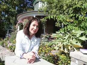 Sandra Bussin is pictured outside the Gardener's Cottage in the Beach. (VERONICA HENRI, Toronto Sun)