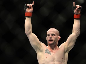 Mitch Gagnon raises his arms in victory during a fight in April. The Sudbury-based fighter won his fourth straight UFC fight Saturday.