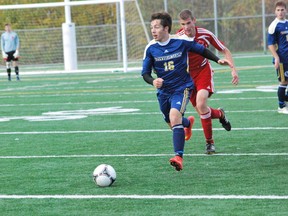 Voyageurs' Joel Levack looks for a teammate to pass to during OUA men's soccer play at James Jerome Sports Complex on Sunday. The Voyageurs won 3-0 over RMC.