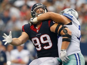 Texans’ J.J. Watt was kept mostly in check by Zack Martin and the Cowboy in Dallas’ 20-17 overtime win yesterday. (AFP)