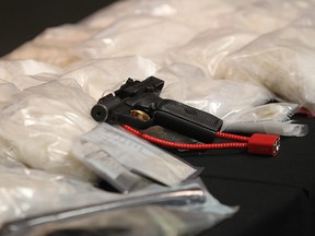 Weapons, Drugs and other items on display at the CPS headquarters, in Calgary, Alta. on Tuesday September 24, 2013.
Two people have been charged in  what’s believed to be the largest meth seizure. Al Charest/Calgary Sun/QMI Agency