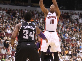 Raptors’ DeMar DeRozan goes up for the shot as Sacramento Kings' Jason Thompson looks in Vancouver on Sunday. Carmine Marinelli/QMI Agency)