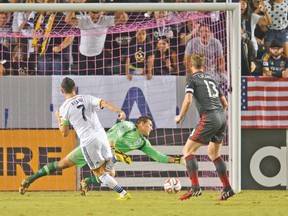 Robbie Keane scores one of his two goals for the Los Angeles Galaxy on Saturday night against Toronoto FC. (USA TODAY SPORTS)