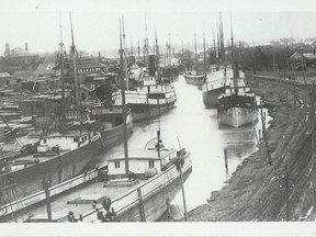 Ships sit along Marine City's Belle River in the early 1900s.