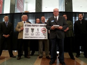 Candidates forming a "property owners" slate speak to reporters at City Hall on Monday, Oct. 6, 2014. JON WILLING/OTTAWA SUN