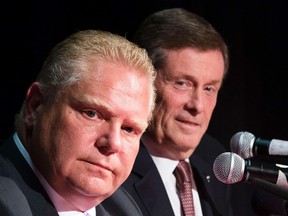Toronto mayoral candidates Doug Ford, foreground, and John Tory. (Reuters file)