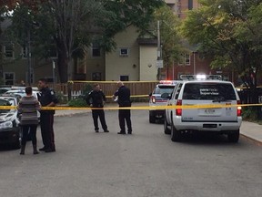 Police at scene of shooting near Shuter and Parliament Sts. Monday, Oct. 6, 2014. (Michael Peake/Toronto Sun)