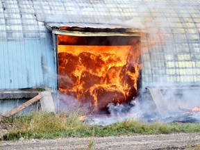 Fire crews in Mayerthorpe, Alta. are letting the fire burn itself out and it's expected to smolder for two weeks. (QMI Agency photo)