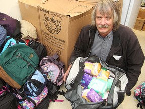 Ron Eldridge of Devoted to You Street Ministries displays some of the items he will be giving away this weekend. (Brian Donogh/Winnipeg Sun/QMI Agency)