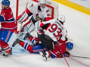 Senators' Mika Zibanejad knocks over Canadiens' Alex Galchenyuk in front of the Ottawa net during pre-season action in Montreal Saturday night. (QMI Agency)