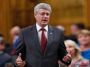 Prime Minister Stephen Harper speaks during Question Period in the House of Commons on Parliament Hill in Ottawa October 1, 2014. REUTERS/Chris Wattie