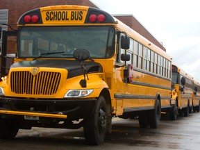 School buses arrive to pick up pupils at Stoney Creek public school in London. (MIKE HENSEN, The London Free Press)