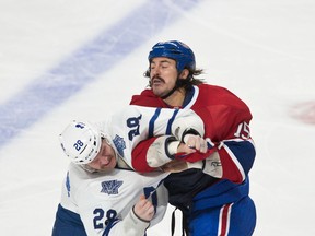 Leafs tough guy Colton Orr (left) goes at it with Canadiens counterpart George Parros during a game last season. Neither player will be around when the two teams open their 2014-15 campaigns on Wednesday night at the ACC. (Ben Pelosse/QMI Agency)